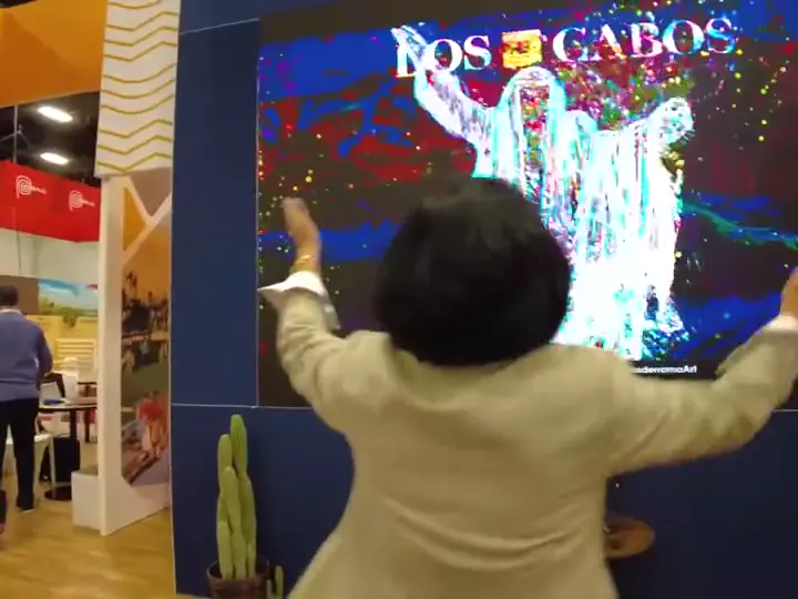 Crowd painting the Los Cabos LED wall with body movement at IMEX America